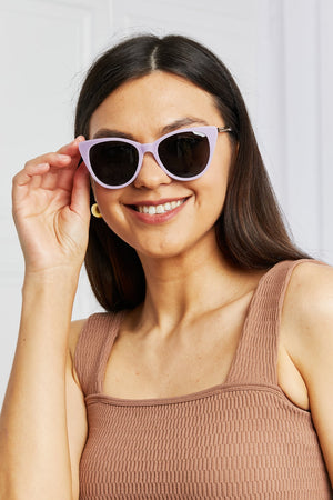 Lavender cat-eye acetate sunglasses with chain detail on temples
