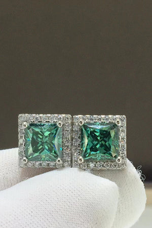 Green square stud earrings with halo of small diamonds