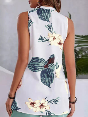 White floral v-neck sleeveless top with teal shorts
