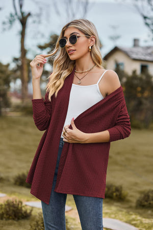 Burgundy textured knit cardigan with a drape-front and long sleeves.