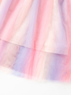 Toddler tulle dress with pastel rainbow tie-dye pattern and layered skirt.