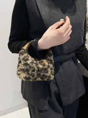 Shearling check mini shoulder bag with brown leather trim.