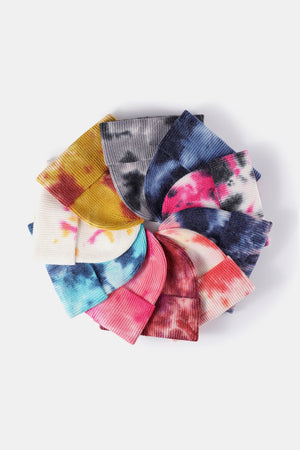 Ribbed knit beanies in assorted tie-dye colors including navy/pink, fuchsia, and sky blue.