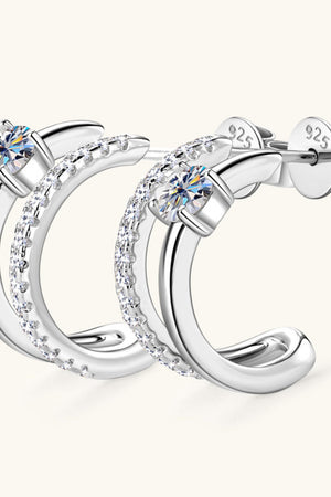 Silver double-band hoop earrings with pavé and solitaire stones.