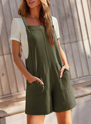 Dark green romper with crisscross straps, square neckline, and patch pockets.