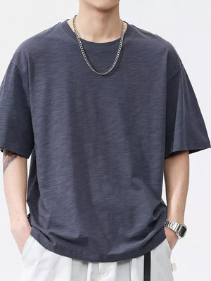 Men's relaxed fit dark gray cotton t-shirt with crew neck and short sleeves.