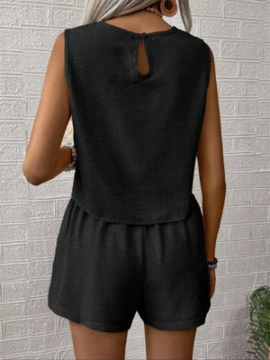 Black textured two-piece set with a sleeveless V-notch top and elastic waist shorts.