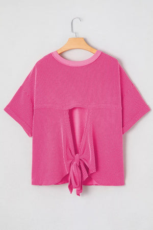 Bold ribbed backless maternity t-shirt in bright pink with a tie-front detail.