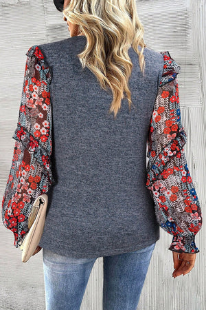 Dark gray knit blouse with floral chiffon balloon sleeves and ruffled cuffs.