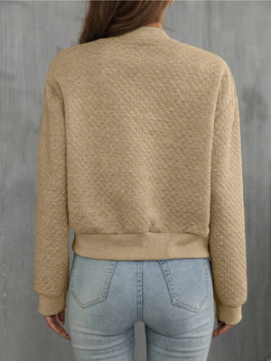 Diamond quilted bomber jacket in camel with ribbed cuffs and hem.