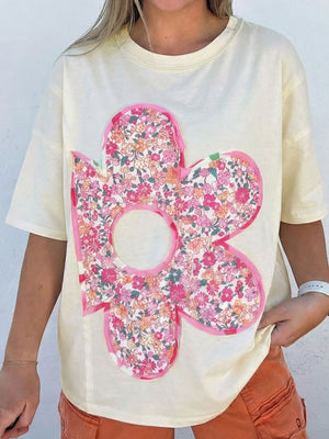 Cream cotton crew neck t-shirt with a large floral chenille patch applique.