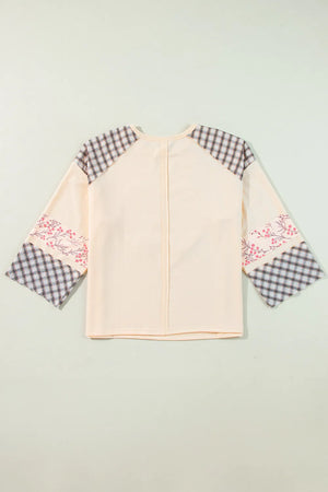 Patchwork heart raglan top in tan with plaid and floral print sleeves.