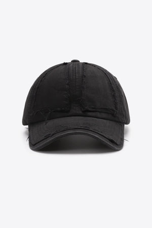 Black denim baseball cap with raw edge details and distressed accents.