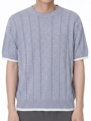 Blue knit t-shirt with crew neck, short sleeves, and white contrast trim.