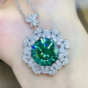 Silver necklace with large emerald halo moissanite pendant and crystal accents.