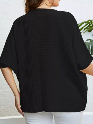Black textured plus-size relaxed-fit t-shirt with short sleeves and a relaxed cut.