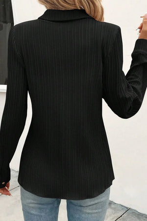 Black textured ribbed button-down shirt with long sleeves.