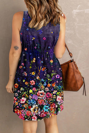 Sleeveless indigo floral print dress with elastic waist and A-line skirt.