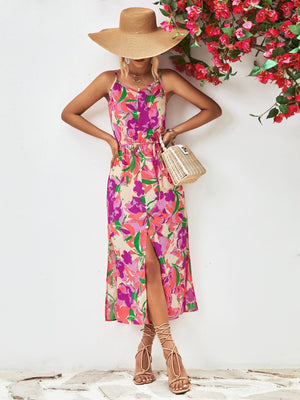 Floral print button-down midi dress with spaghetti straps and a high slit.