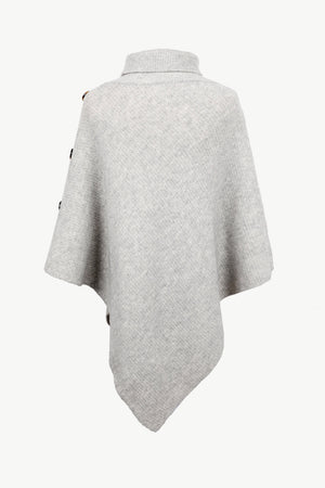 Light gray acrylic turtleneck knit poncho with button details on the shoulder.