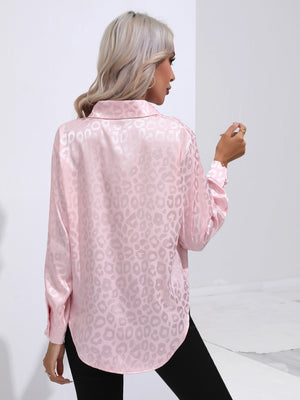 Blush pink satin button-down shirt with embossed leopard print and long sleeves.