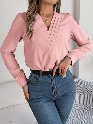 Dusty Pink V-neckline blouse with pleated detail and long sleeves.