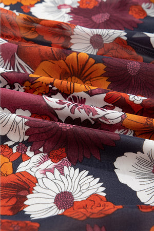 Floral wrap mini dress with puff sleeves in a dark floral print.