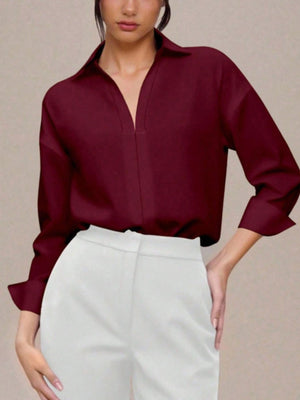 Classic collared long sleeve bodysuit in wine red with a deep V-neck detail.