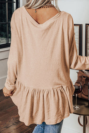Peplum button-down V-neck top in Dust Storm cotton with ruffled hem.