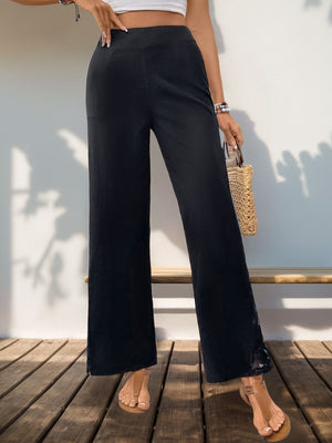 Black lace inset palazzo trousers with a wide leg
