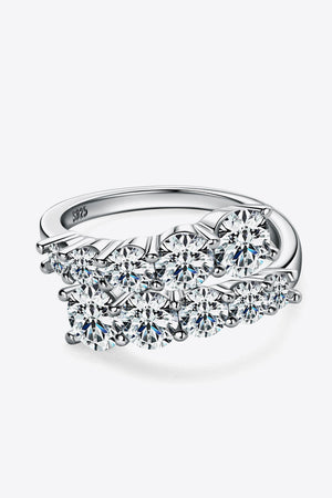 Silver cascading cluster diamond ring with multiple round cut stones on a 925 sterling silver band.
