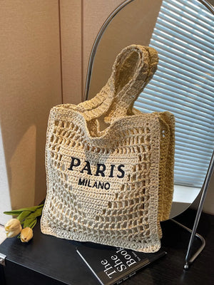 Airy crochet knit tote bag in off-white with "PARIS MILANO" text detail.