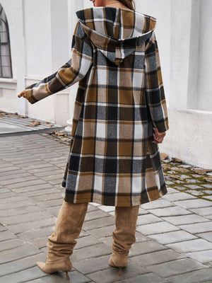 Brown plaid hooded duster coat with buttoned front and A-line cut.