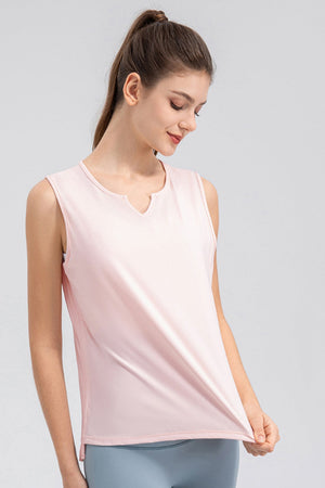 Blush pink active tank top with notched neckline and sleeveless design.