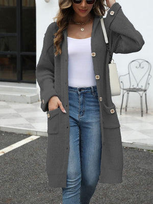 Longline gray knit cardigan with hood, buttons, and pockets.
