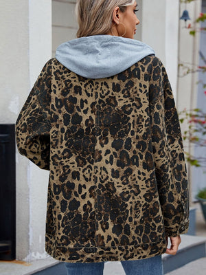 Leopard print denim utility jacket with removable grey hood, shown from the back.