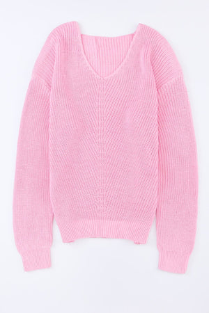 Relaxed knit v-neck pullover sweater in blush pink acrylic with chevron stitch detail.