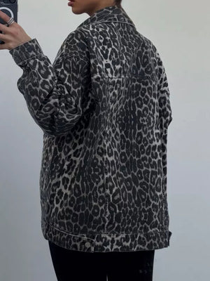 Oversized leopard wash denim jacket with button closure and collar.