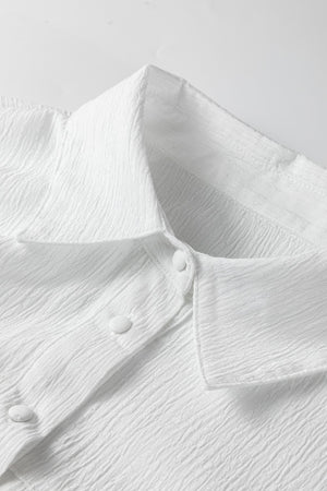 White crinkled texture button-down shirt with classic collar and button detail