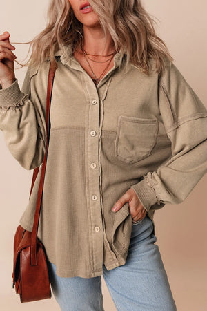 Tan waffle knit overshirt with patch pocket and button front, styled with jeans.