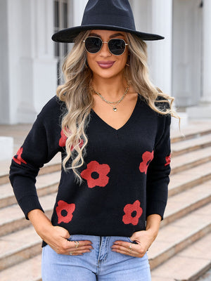 Black acrylic v-neck sweater with a red daisy print.