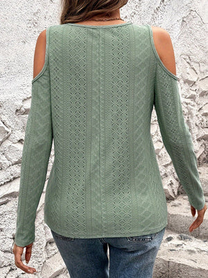 Sage open-shoulder knit top with geometric eyelet pattern and long sleeves.