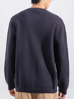 Men's dark gray ribbed knit top with crew neck and long sleeves.