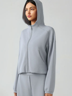 Gray cropped active hoodie with zip front, raglan sleeves, and pockets
