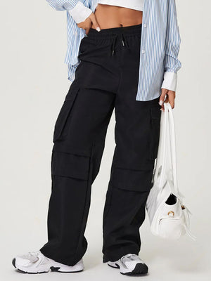 Black utility cargo pants with wide legs and multiple pockets.