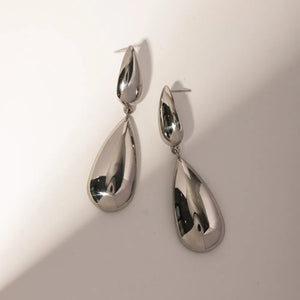 Silver teardrop dangle earrings with a high-shine polished finish.