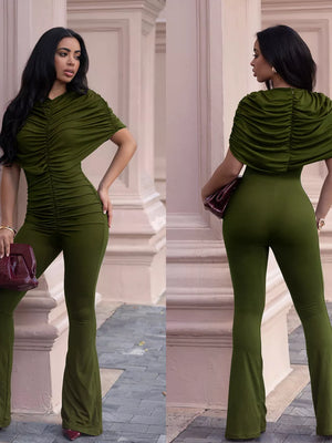 Olive green ruched romper with cap sleeves and flared legs.