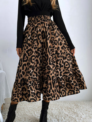 Leopard print tiered midi skirt with elastic waistband and ruffled hem.