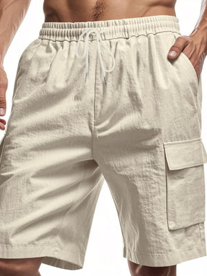 Khaki relaxed fit drawstring cargo shorts with utility pockets and elastic waistband.