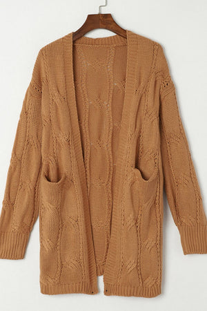 Camel cable knit open-front cardigan with pockets and intricate stitch detail.